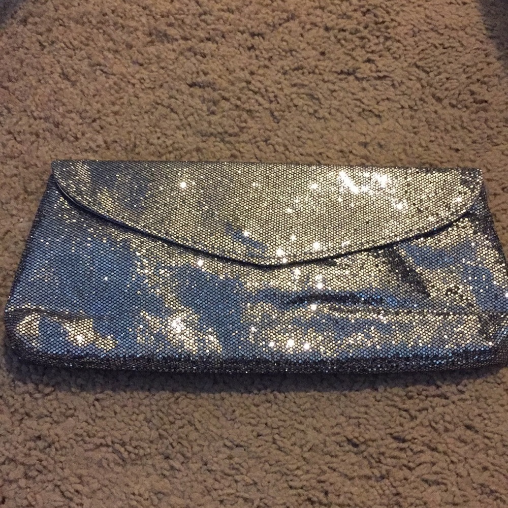 NWT silver sparkle mesh clutch.